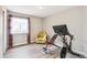 Home exercise room featuring a window, chair, and home gym equipment at 3612 Rosewalk Cir, Highlands Ranch, CO 80129