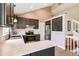 Spacious kitchen featuring stainless steel appliances, light countertops, and breakfast bar seating at 3612 Rosewalk Cir, Highlands Ranch, CO 80129