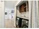Modern laundry room with sleek appliances and ample storage space, designed for convenience at 3612 Rosewalk Cir, Highlands Ranch, CO 80129