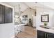 Open floor plan with kitchen views, wood floors, vaulted ceilings and great natural light at 3612 Rosewalk Cir, Highlands Ranch, CO 80129