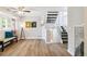 Spacious living room with hardwood floors, stylish decor, and a ceiling fan for comfortable living at 3612 Rosewalk Cir, Highlands Ranch, CO 80129