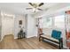 Bright living room with natural light, featuring a cozy bench and stylish decorations at 3612 Rosewalk Cir, Highlands Ranch, CO 80129