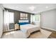 Well-lit main bedroom with neutral tones, multiple windows, and a decorative chandelier at 3612 Rosewalk Cir, Highlands Ranch, CO 80129