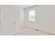 A brightly lit bedroom featuring neutral carpet and a double-hung window at 18120 Dandy Brush Ln, Parker, CO 80134