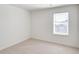 Bedroom features neutral carpet, and a single window at 18120 Dandy Brush Ln, Parker, CO 80134