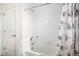 White tiled bathroom with bathtub and shower at 4715 River Highlands Loop, Elizabeth, CO 80107