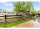 Landscaped backyard with a fence, grass, and concrete patio at 12973 Grant E Cir # A, Thornton, CO 80241