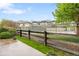 Community pool view from a fenced backyard with flowers at 12973 Grant E Cir # A, Thornton, CO 80241