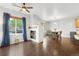 Dining area with hardwood floors, stylish table, and door to outside at 12973 Grant E Cir # A, Thornton, CO 80241