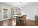 Dining room with hardwood floor, light fixture and table with chairs at 12973 Grant E Cir # A, Thornton, CO 80241