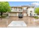 Exterior of a townhome with 3 car garage and a black car at 12973 Grant E Cir # A, Thornton, CO 80241