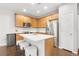 Cozy kitchen features stainless appliances, eat in island, and seamless transition to the dining area at 12973 Grant E Cir # A, Thornton, CO 80241