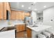 Kitchen featuring stainless steel appliances, marble countertops, and an island with bar stool seating at 12973 Grant E Cir # A, Thornton, CO 80241