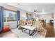 Open living area with hardwood floors and a fireplace at 12973 Grant E Cir # A, Thornton, CO 80241