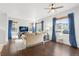Bright living room with hard wood floors, ceiling fan and cozy furniture at 12973 Grant E Cir # A, Thornton, CO 80241