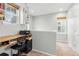 Well-lit office area with a desk, shelving, and windows providing natural light at 12973 Grant E Cir # A, Thornton, CO 80241