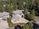 A lovely home with stone accents, mature landscaping, and a spacious driveway, surrounded by mature trees at 3104 Ramshorn Dr, Castle Rock, CO 80108