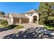 Elegant home exterior featuring a three-car garage, well-maintained landscaping, and a welcoming entrance at 3104 Ramshorn Dr, Castle Rock, CO 80108