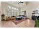 Bright living room with high ceilings, large windows, and hardwood floors at 3104 Ramshorn Dr, Castle Rock, CO 80108