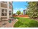 Manicured backyard featuring a bench, lush lawn and rock border at 2359 Indian Paintbrush Cir, Highlands Ranch, CO 80129
