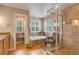 Bathroom featuring a soaking tub, glass enclosed shower and decorative tile accents at 2359 Indian Paintbrush Cir, Highlands Ranch, CO 80129