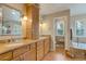 Bathroom with double vanity sinks, granite counters and separate tub and toilet rooms at 2359 Indian Paintbrush Cir, Highlands Ranch, CO 80129