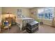 Bedroom with a comfortable bed, dresser, and bright window at 2359 Indian Paintbrush Cir, Highlands Ranch, CO 80129