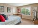 Bright bedroom with large window, and neutral walls at 2359 Indian Paintbrush Cir, Highlands Ranch, CO 80129