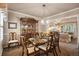 Elegant dining room with a wooden table set for a meal, chandelier, and a china cabinet at 2359 Indian Paintbrush Cir, Highlands Ranch, CO 80129