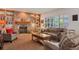 Inviting living room features a brick fireplace, built-in shelves, and comfortable seating at 2359 Indian Paintbrush Cir, Highlands Ranch, CO 80129