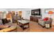 Open living area with a view to the kitchen, TV, and neutral decor at 2359 Indian Paintbrush Cir, Highlands Ranch, CO 80129