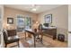 Bright home office with hardwood floors, large window, and functional workspace at 2359 Indian Paintbrush Cir, Highlands Ranch, CO 80129