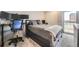 Bedroom featuring a workstation, a large bed, and a window with natural light at 130 N Pearl St # 1001, Denver, CO 80203