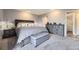 Bedroom with plush carpeting, a king bed, and stylish gray furniture at 130 N Pearl St # 1001, Denver, CO 80203