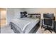Cozy bedroom with plush carpeting, a large bed, and a workstation area at 130 N Pearl St # 1001, Denver, CO 80203