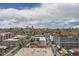 Expansive city view with residential buildings, green spaces, and a dramatic cloudy sky at 130 N Pearl St # 1001, Denver, CO 80203