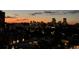 This photo highlights the skyline view with construction cranes silhouetted against the evening sky at 130 N Pearl St # 1001, Denver, CO 80203