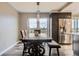 Dining area features stylish furniture and city views at 130 N Pearl St # 1001, Denver, CO 80203
