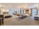 Bright game room featuring a pool table, fireplace, and ample seating with stylish light fixture at 130 N Pearl St # 1001, Denver, CO 80203