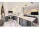 Bright kitchen showcasing stainless steel appliances, a peninsula with seating, and an open layout to living area at 130 N Pearl St # 1001, Denver, CO 80203