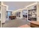 Cozy library with expansive built-in shelving and intimate seating provides a serene space for reading and relaxing at 130 N Pearl St # 1001, Denver, CO 80203