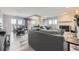 Open-concept living room boasts fireplace, dining area, and abundant natural light at 130 N Pearl St # 1001, Denver, CO 80203
