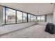 Inviting living room boasting expansive windows with a beautiful city view creating a bright and airy atmosphere at 130 N Pearl St # 1001, Denver, CO 80203
