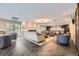 Spacious living room with sleek flooring, modern fireplace and ample seating that creates an ideal space for relaxation and entertainment at 130 N Pearl St # 1001, Denver, CO 80203