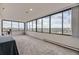 Bright living room with large windows providing a panoramic city view, enhancing the space with natural light and scenery at 130 N Pearl St # 1001, Denver, CO 80203