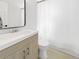 Clean, bright bathroom featuring a modern vanity and a shower with a curtain at 828 Mariposa St, Denver, CO 80204