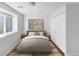 Stylized bedroom featuring neutral color palette, ample natural light, and closet at 828 Mariposa St, Denver, CO 80204