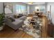 Inviting living room featuring a stylish sectional, wood floors, and ample natural light at 828 Mariposa St, Denver, CO 80204