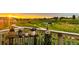 Enjoy the sunset from this balcony, with flower planters and views of walking trails and neighborhood at 6805 Zebra Grass Ln, Parker, CO 80138
