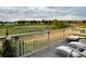 Relax on this balcony with lounge chairs and views of the walking trails and green space at 6805 Zebra Grass Ln, Parker, CO 80138